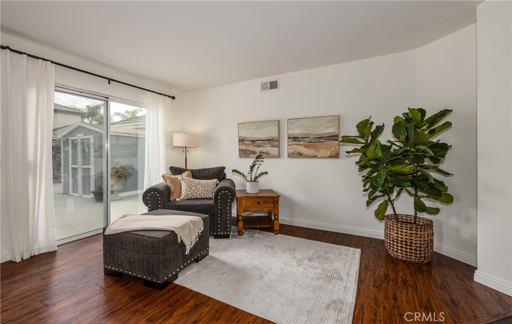 1951 Annapolis Circle Corona, CA 92881 - Photo 17 of 42 a bedroom with furniture and a potted plant