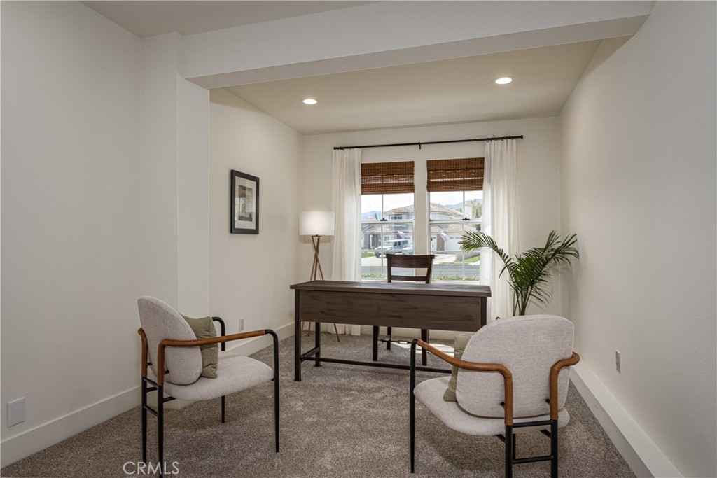 1951 Annapolis Circle Corona, CA 92881 - Photo 20 of 42 a view of a workspace room with furniture and a potted plant