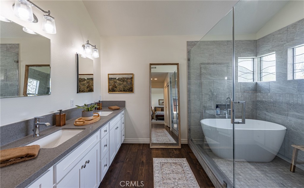 1951 Annapolis Circle Corona, CA 92881 - Photo 25 of 42 a spacious bathroom with a double vanity sink double mirror and bathtub