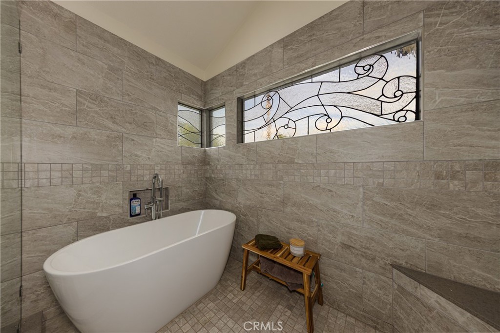 1951 Annapolis Circle Corona, CA 92881 - Photo 26 of 42 a white bath tub sitting next to a white sink and vanity