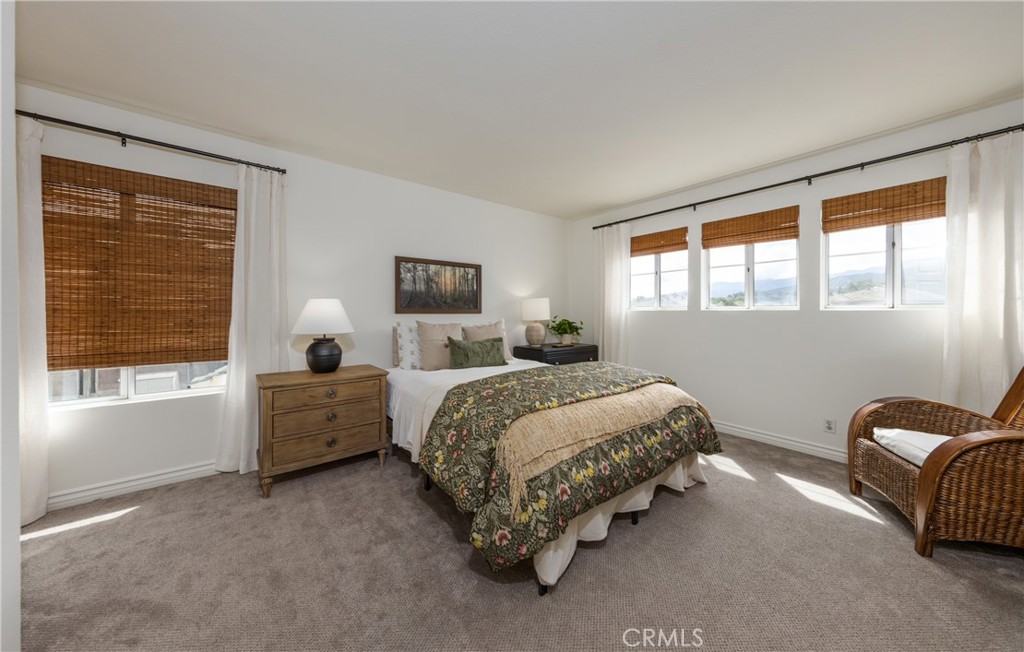 1951 Annapolis Circle Corona, CA 92881 - Photo 29 of 42 a spacious bedroom with a bed and a large window