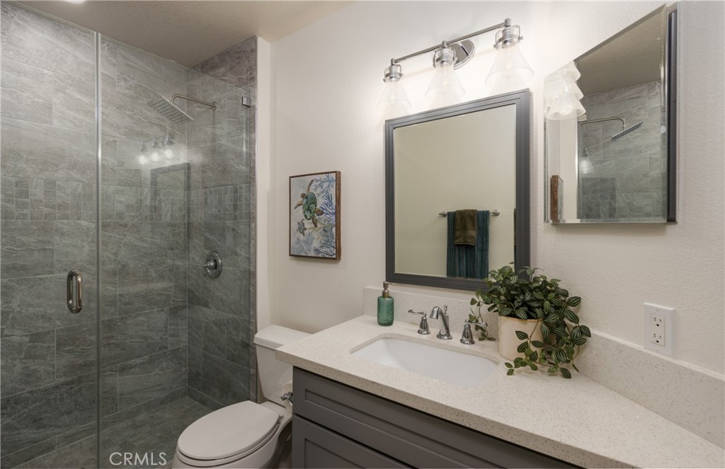 1951 Annapolis Circle Corona, CA 92881 - Photo 30 of 42 a bathroom with a sink a toilet and shower