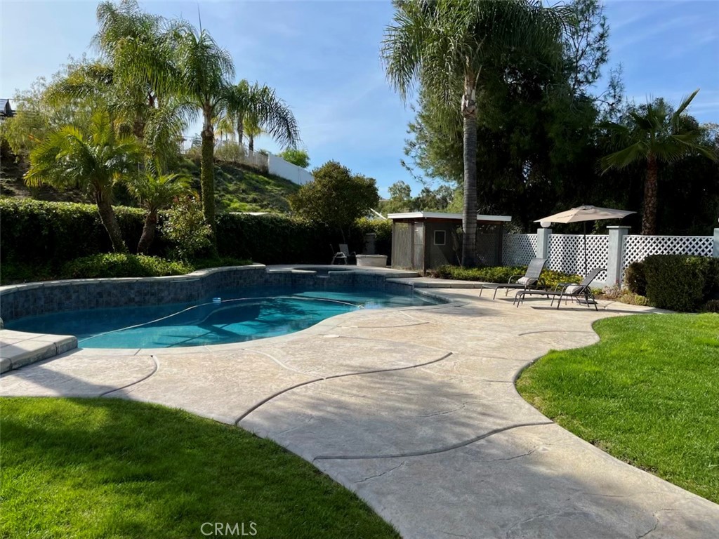 1951 Annapolis Circle Corona, CA 92881 - Photo 36 of 42 a swimming pool with outdoor seating and yard