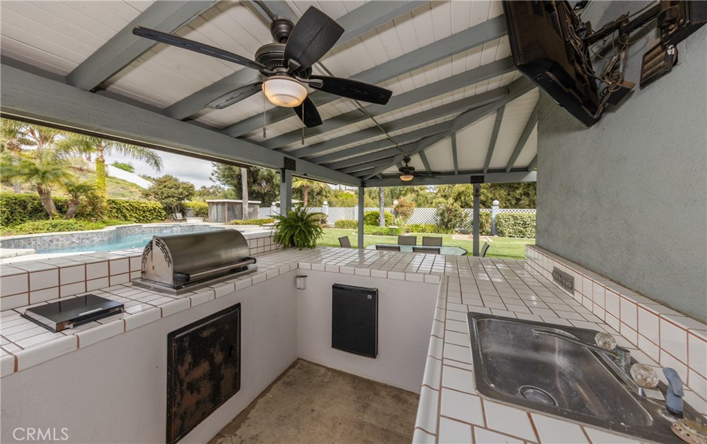 1951 Annapolis Circle Corona, CA 92881 - Photo 40 of 42 a view of a kitchen with wooden floor and stainless steel appliances