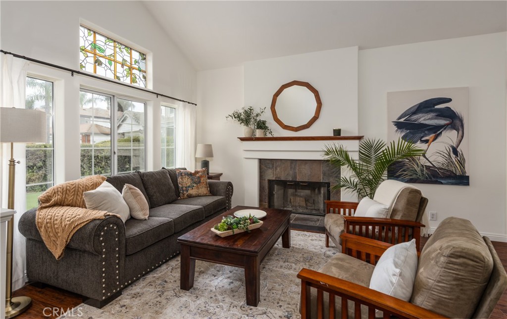 1951 Annapolis Circle Corona, CA 92881 - Photo 6 of 42 a living room with furniture a fireplace a large window and a large window