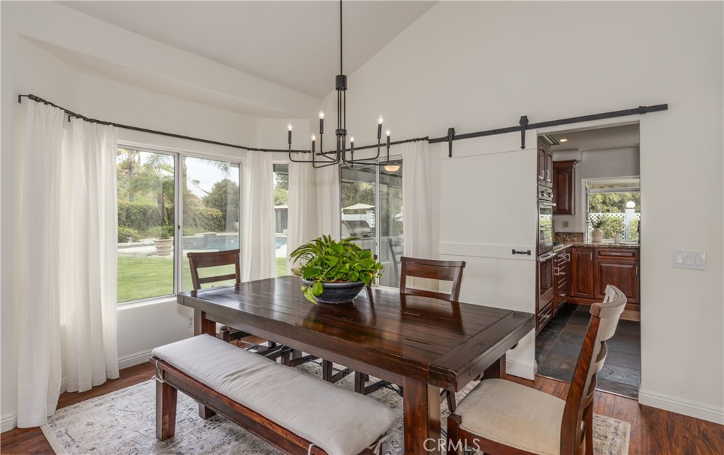 1951 Annapolis Circle Corona, CA 92881 - Photo 7 of 42 a view of a dining room with furniture window and wooden floor