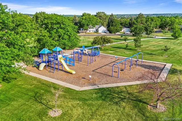 an aerial view of a house with a yard