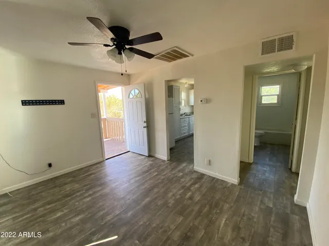 a view of an empty room with a window