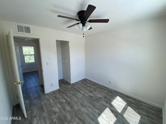 a view of a livingroom with a chandelier fan