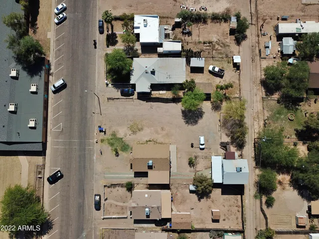 an aerial view of a house with a yard