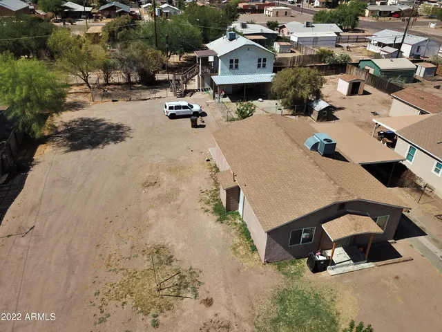 an aerial view of a house with outdoor space