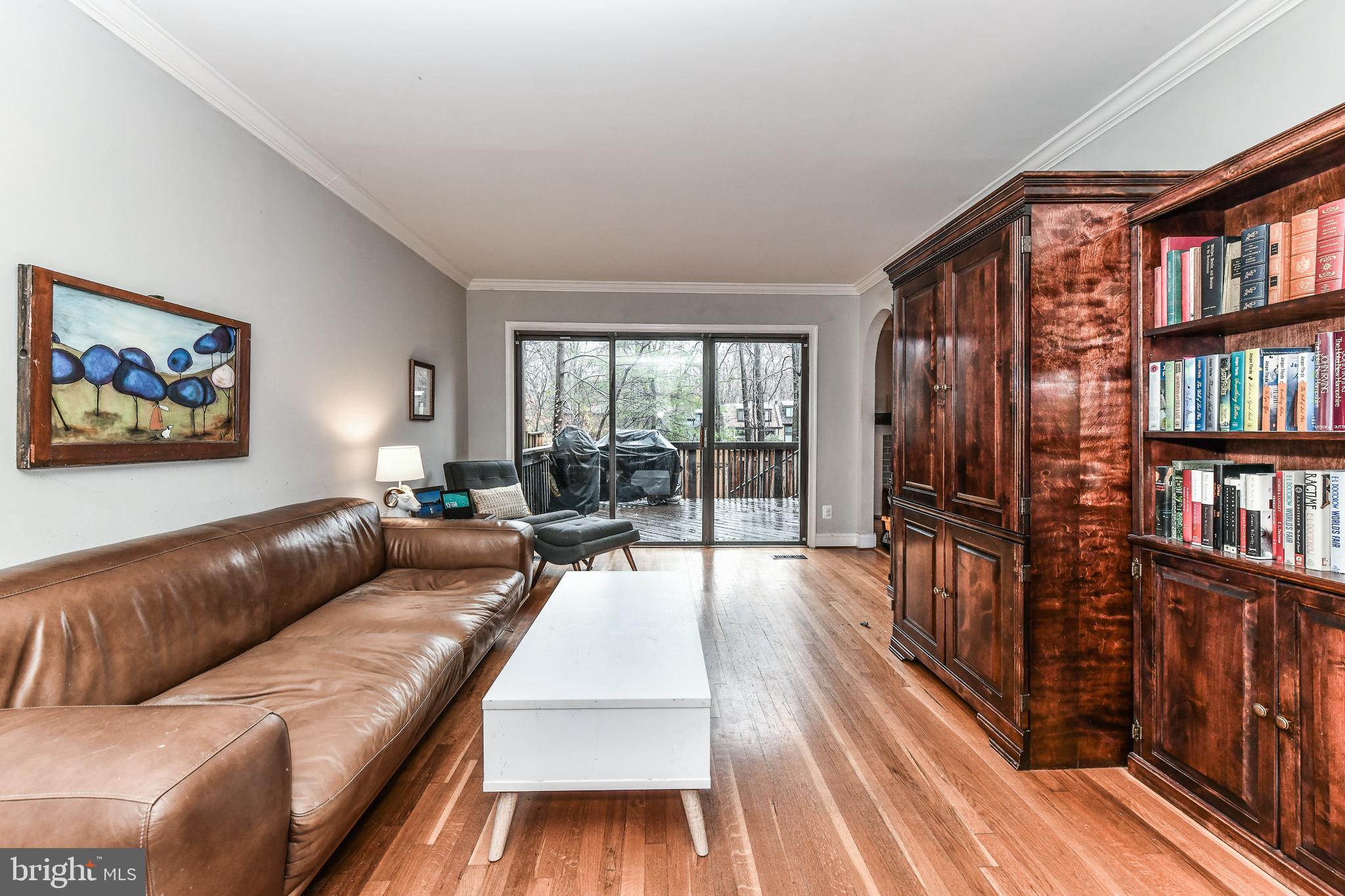 1563 Scandia Circle Reston, VA 20190 - Photo 12 of 41 Living Room with Sliding Glass Doors to Deck