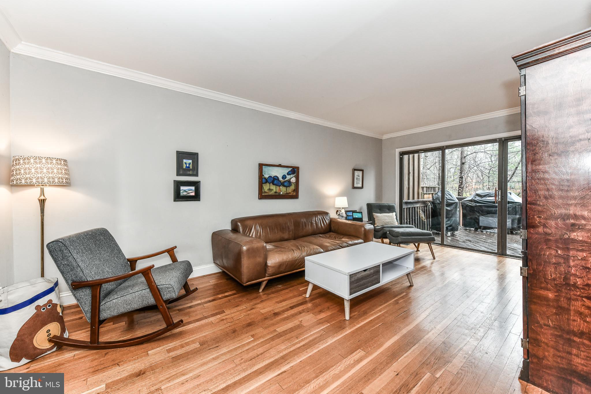 1563 Scandia Circle Reston, VA 20190 - Photo 13 of 41 Living Room with Sliding Glass Doors to Deck