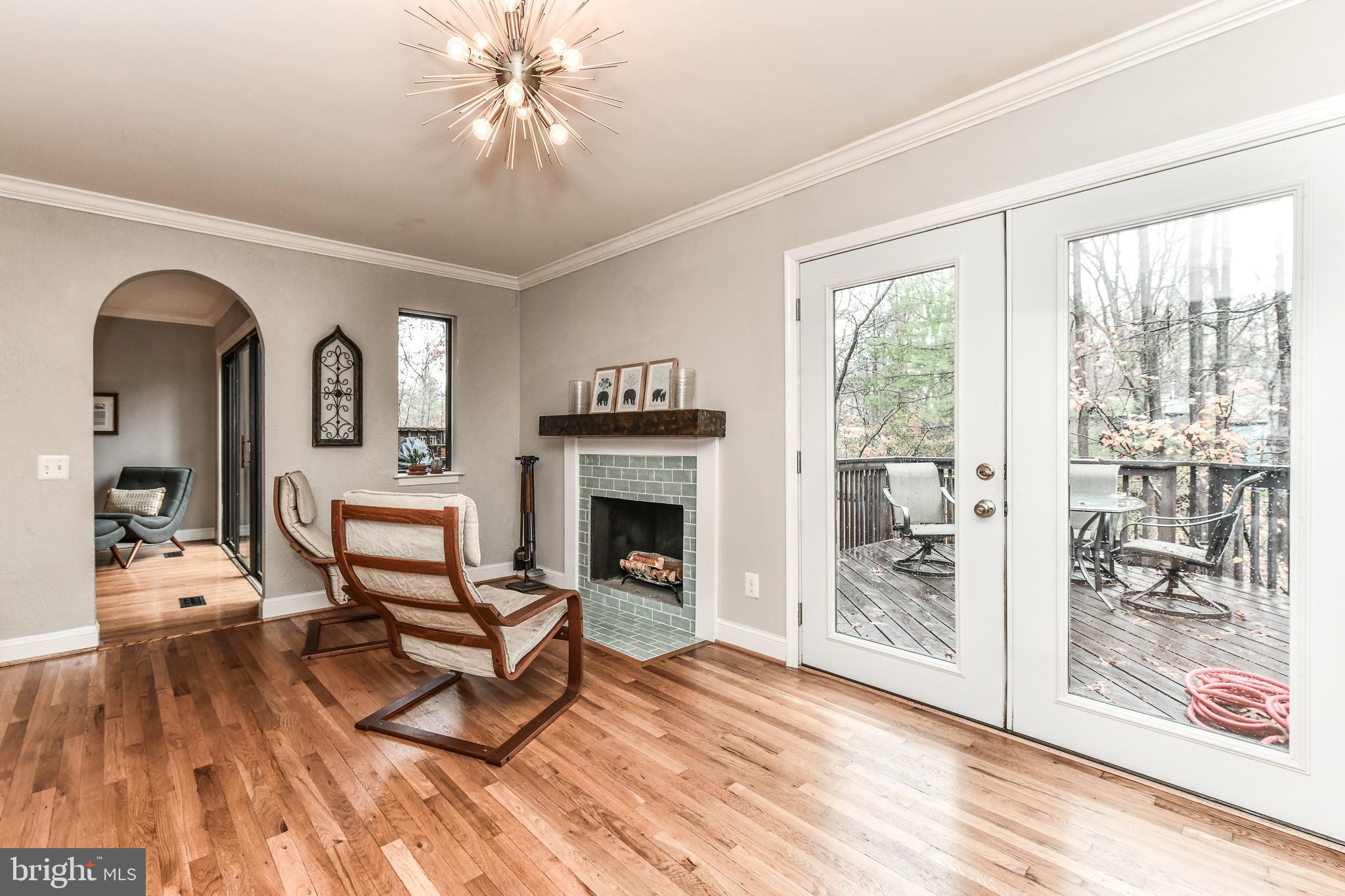1563 Scandia Circle Reston, VA 20190 - Photo 21 of 41 Family Room w/ Wd Burning Fireplace & Door to Deck