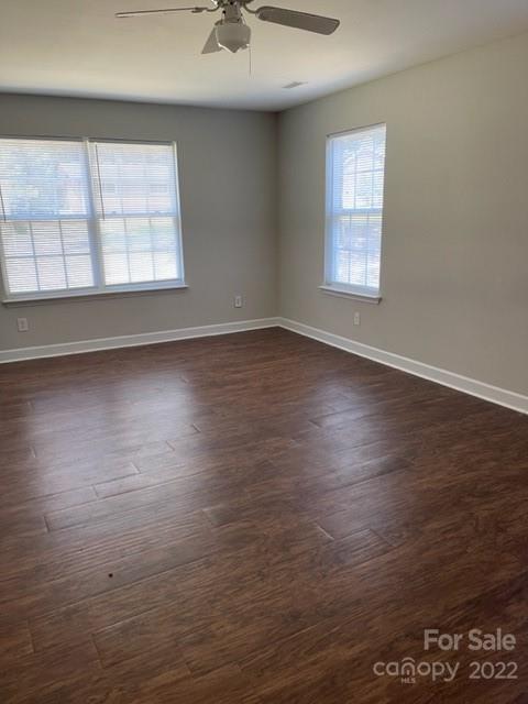 178 Quail Ridge Lane Fort Mill, SC 29708 - Photo 14 of 25 an empty room with wooden floor and windows