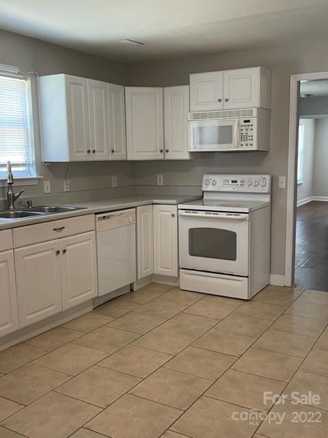 178 Quail Ridge Lane Fort Mill, SC 29708 - Photo 3 of 25 a kitchen with cabinets and white stainless steel appliances