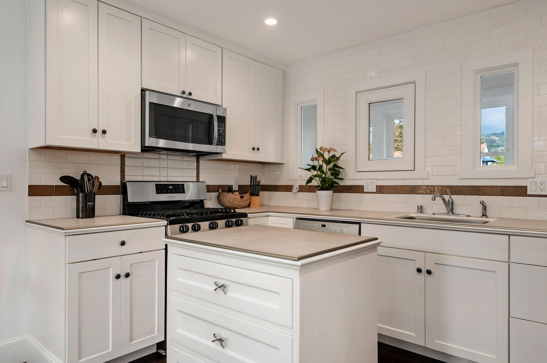 Undisclosed Address Santa Barbara, CA 93101 - Photo 12 of 27 a kitchen with appliances a sink and cabinets
