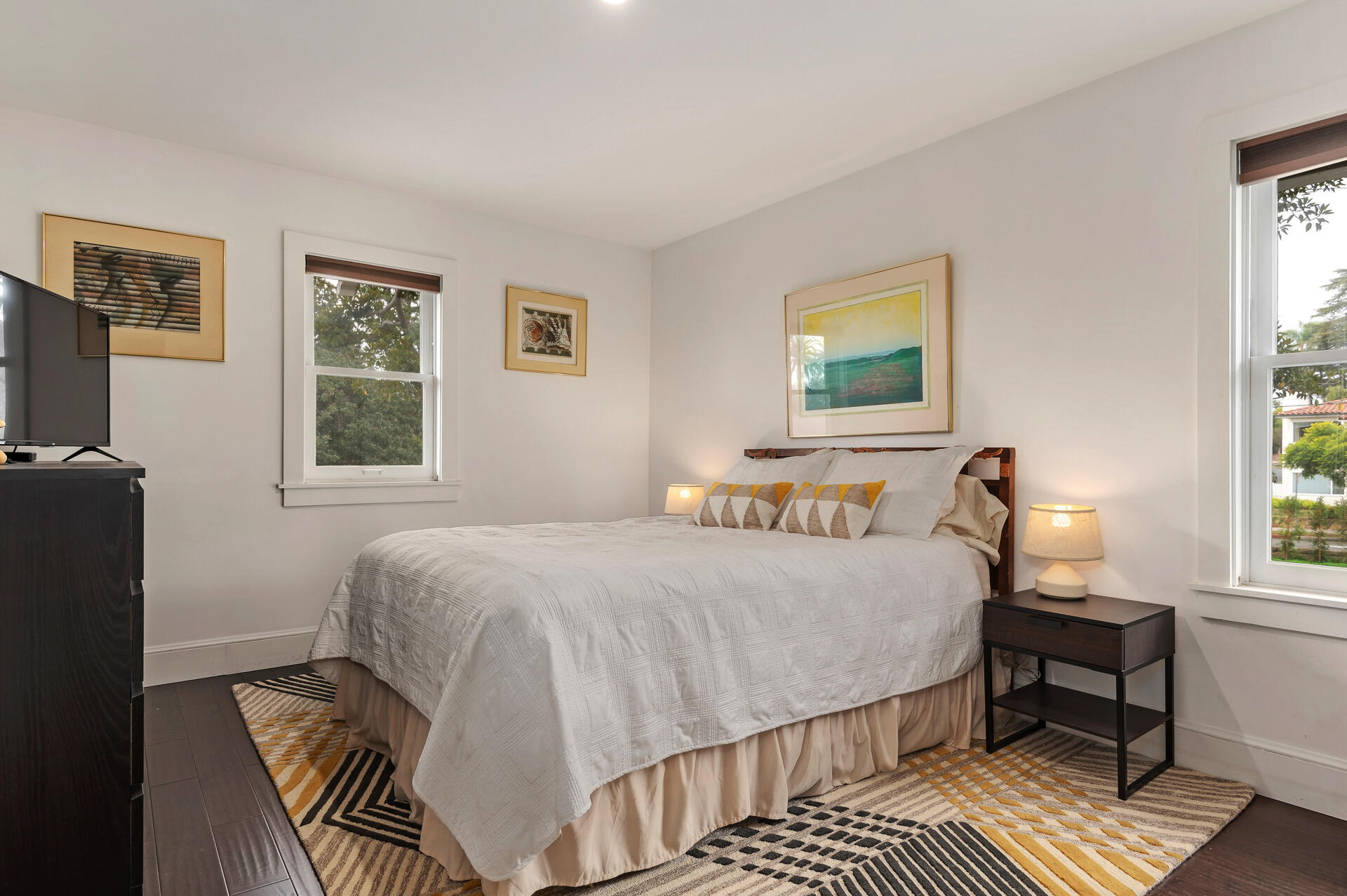 Undisclosed Address Santa Barbara, CA 93101 - Photo 15 of 27 a bedroom with a bed wooden floor and a window