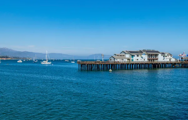 a view of a big room with balcony and ocean view