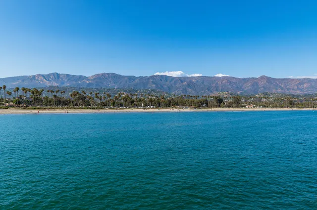 a view of a lake with mountains in the background
