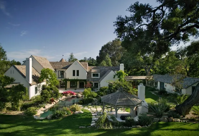 a front view of house with yard and green space