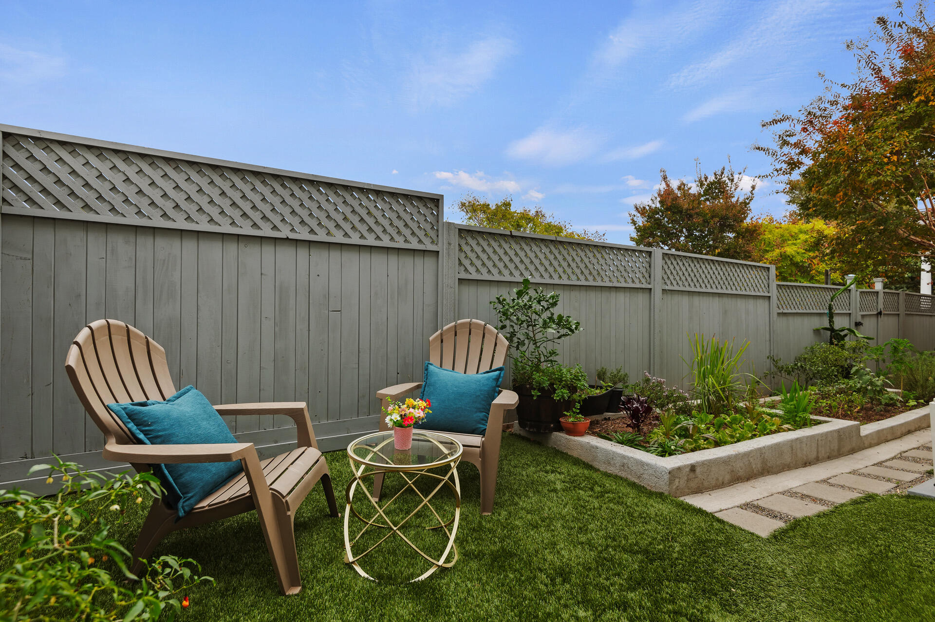 Undisclosed Address Santa Barbara, CA 93101 - Photo 5 of 27 a patio with table and chairs potted plants and wooden fence