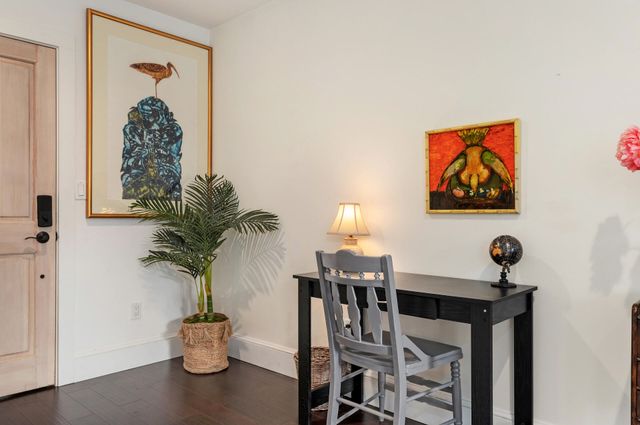 a table with vase and flowers on it