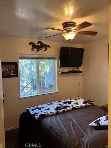 a view of a hallway with closet and a bathroom