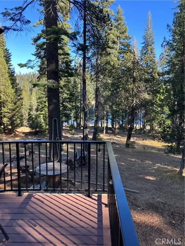a view of balcony with furniture and wooden deck