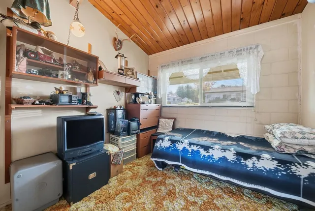 a room with furniture and a rug