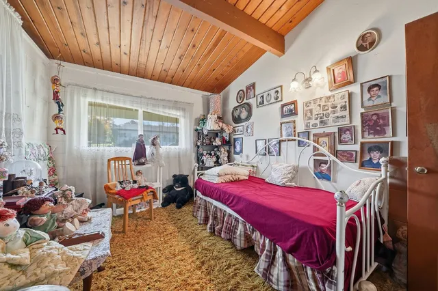 a bedroom with a bed and closet