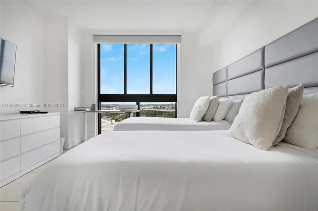 a bedroom with a bed and a closet