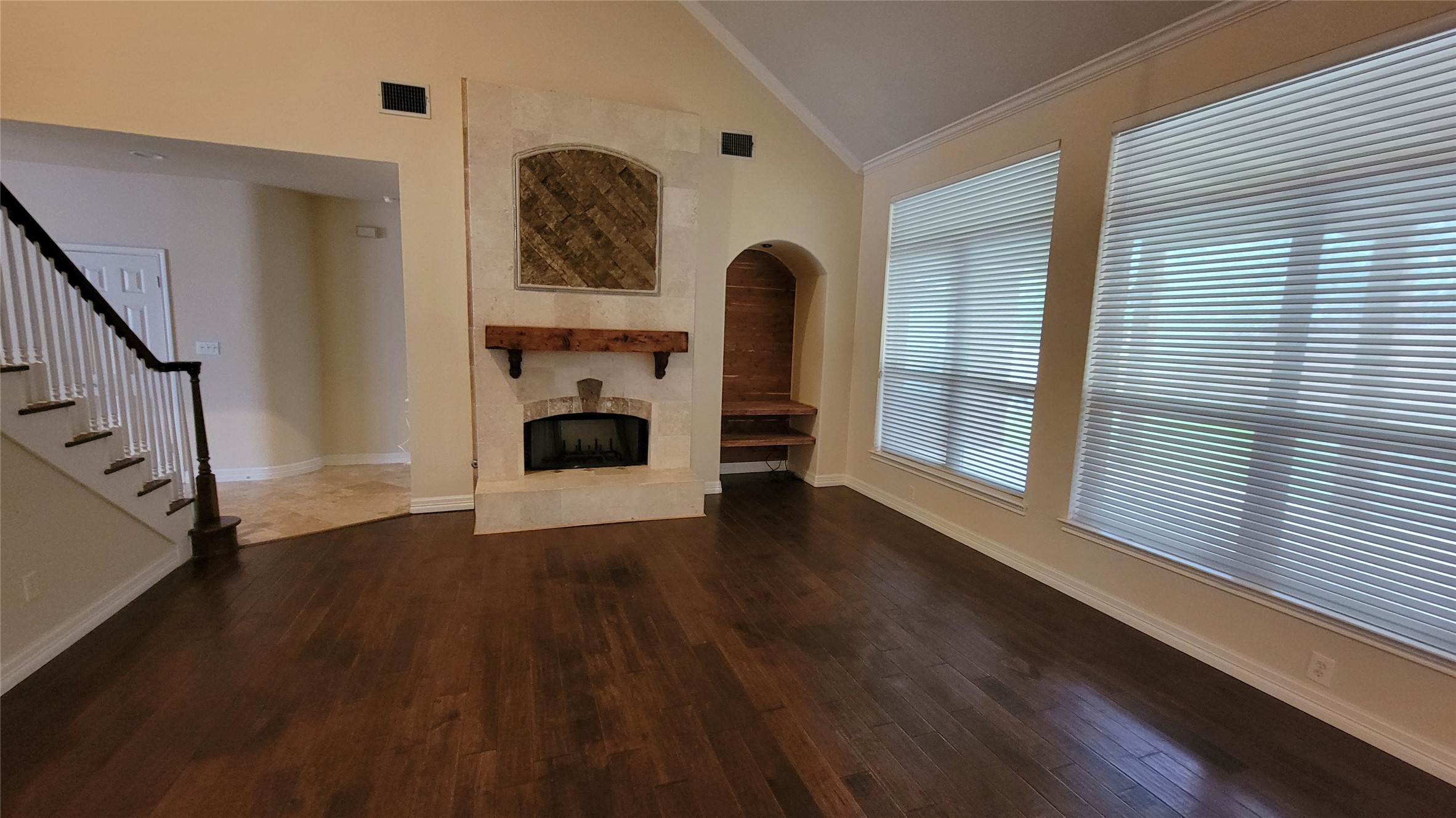 2832 Grimes Ranch Road Austin, TX 78732 - Photo 9 of 37 Rich hardwood floors welcome you to a spacious living area featuring a prominent fireplace and vaulted ceilings.