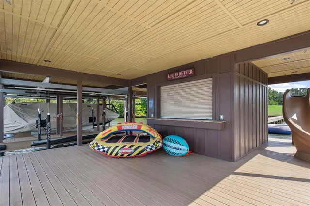a view of a house with pool and a yard