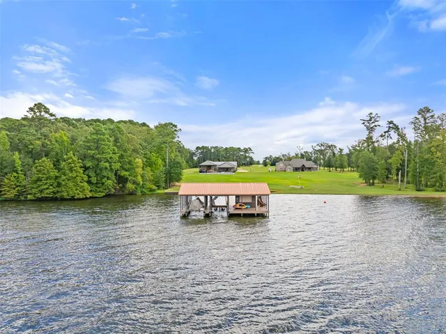 a view of swimming pool with outdoor seating