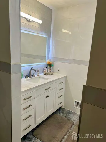 a bathroom with a toilet and a shower curtain