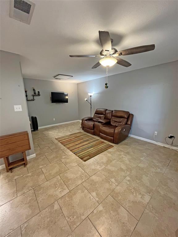 1705 Crossing Place, Unit 131 Austin, TX 78741 - Photo 3 of 13 a bedroom with a bed and a chandelier