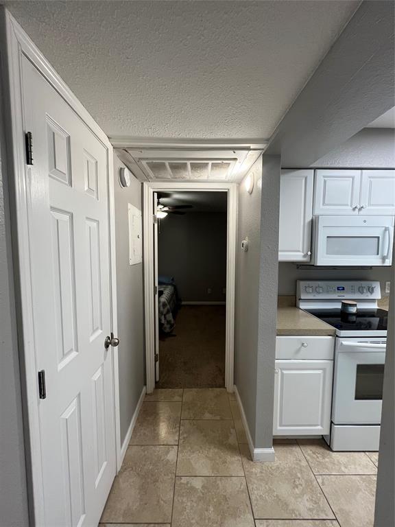 1705 Crossing Place, Unit 131 Austin, TX 78741 - Photo 6 of 13 a view of a kitchen from the hallway