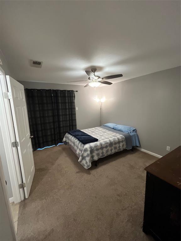 1705 Crossing Place, Unit 131 Austin, TX 78741 - Photo 9 of 13 a bedroom with a bed and window