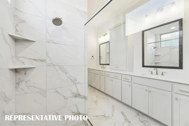 an empty room with windows and ceiling fan