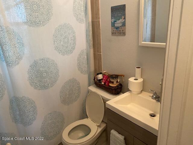 39-41 Patrick Lane, Unit A & B Rockledge, FL 32955 - Photo 12 of 22 a bathroom with a toilet and a sink