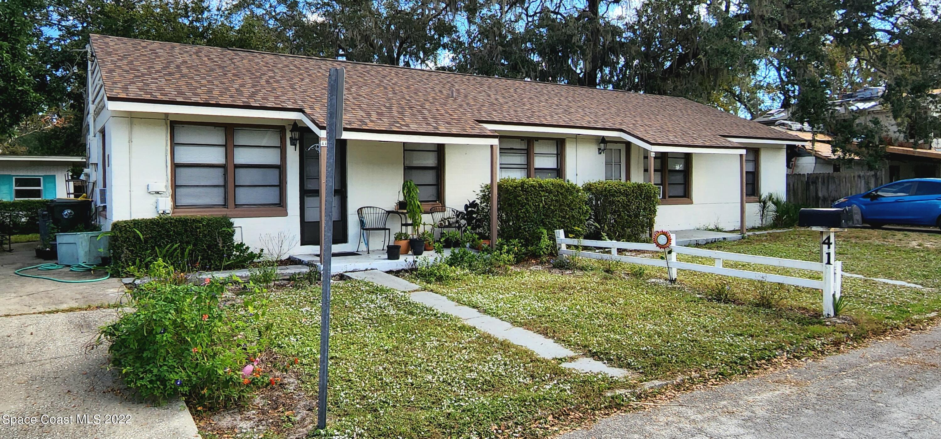 39-41 Patrick Lane, Unit A & B Rockledge, FL 32955 - Photo 18 of 22 a front view of a house with a yard