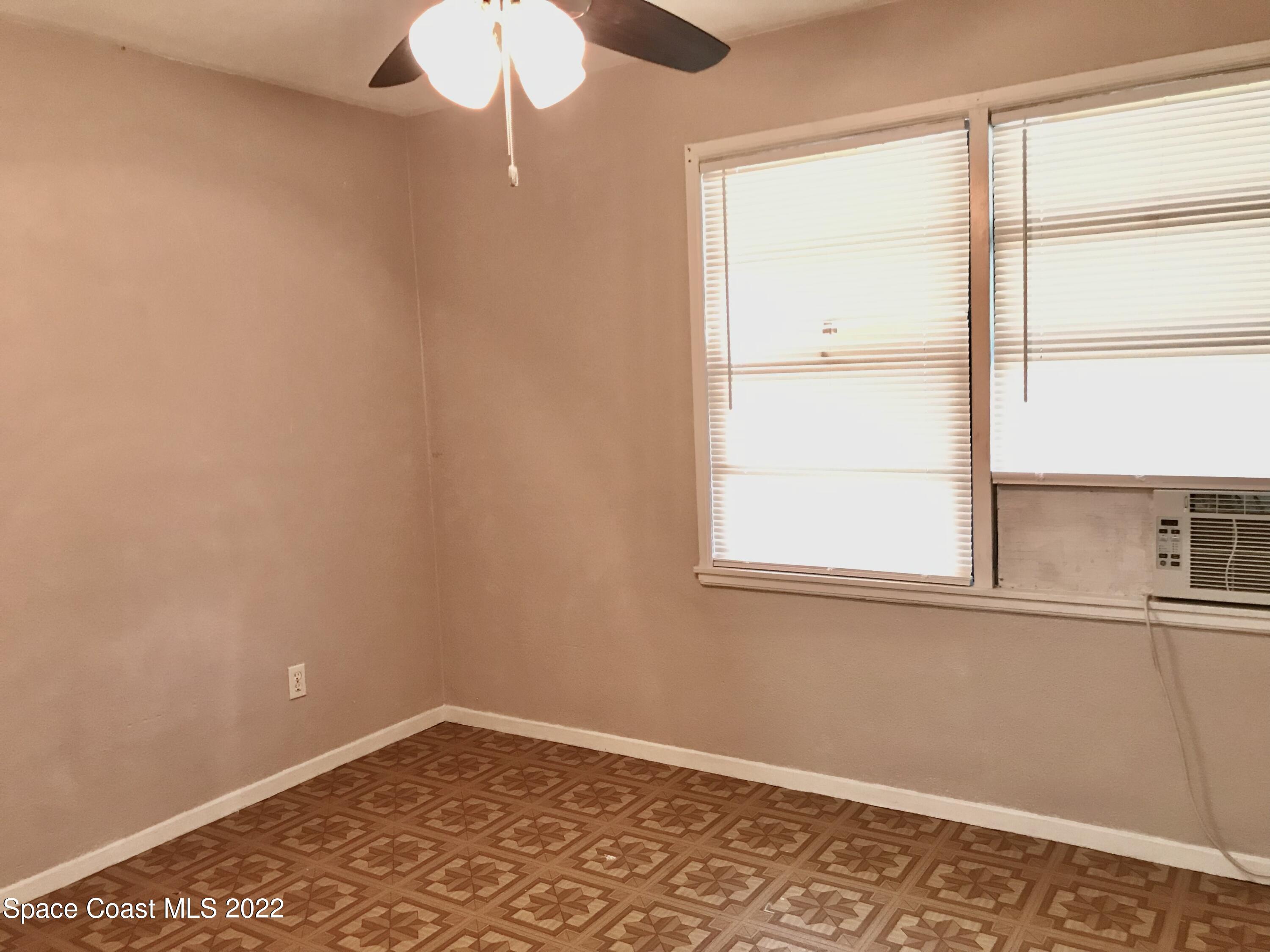 39-41 Patrick Lane, Unit A & B Rockledge, FL 32955 - Photo 6 of 22 an empty room with a window