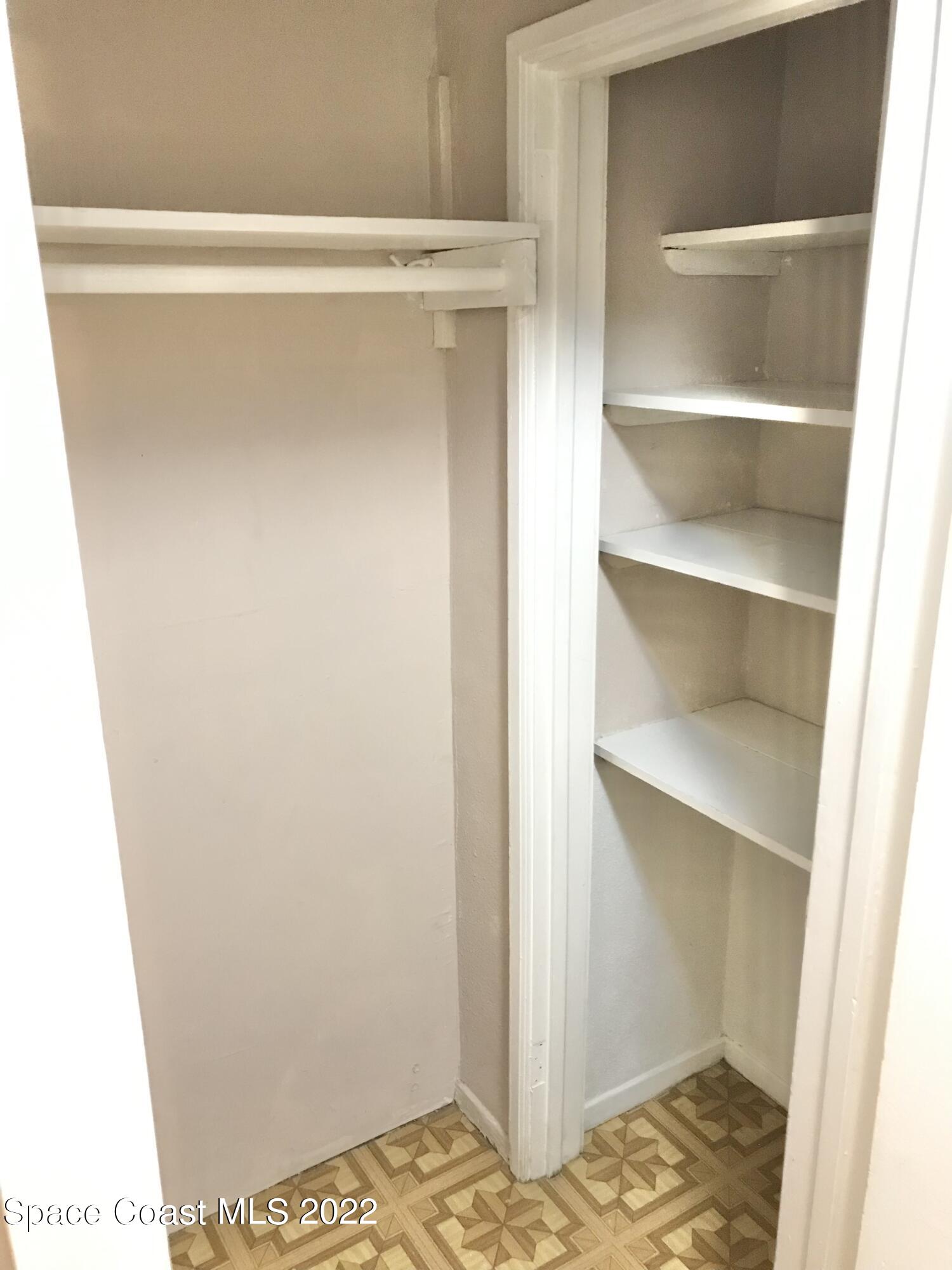 39-41 Patrick Lane, Unit A & B Rockledge, FL 32955 - Photo 8 of 22 a view of walk in closet with empty racks