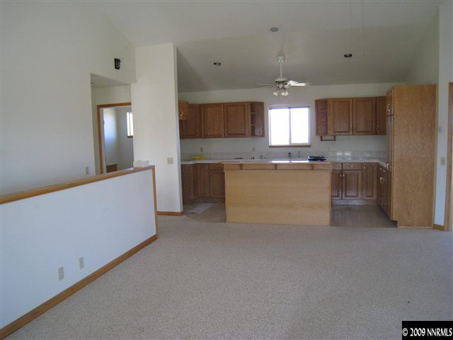 21380 Graves Road Reno, NV 89521 - Photo 4 of 6 a kitchen with cabinets and window