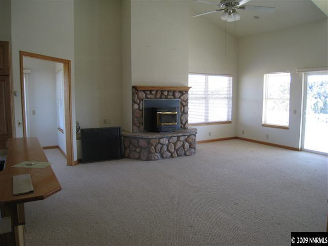 21380 Graves Road Reno, NV 89521 - Photo 5 of 6 a living room with furniture and a fireplace