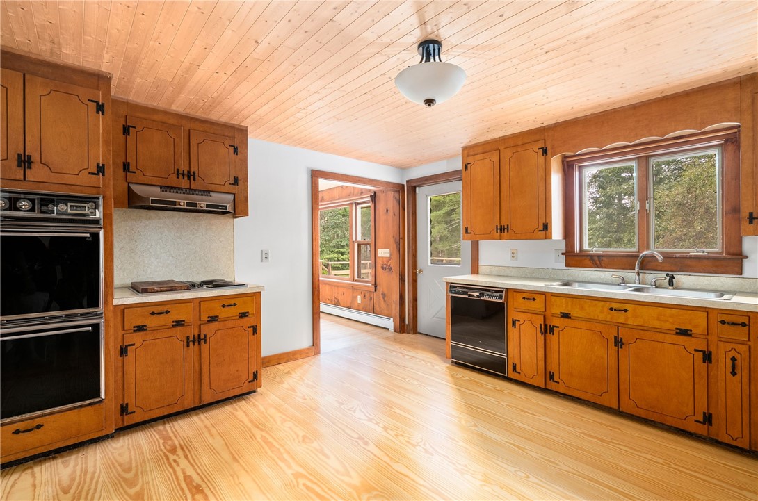 1104 Sisson Road Coventry, RI 02827 - Photo 14 of 50 Kitchen with door to deck and waterfront views