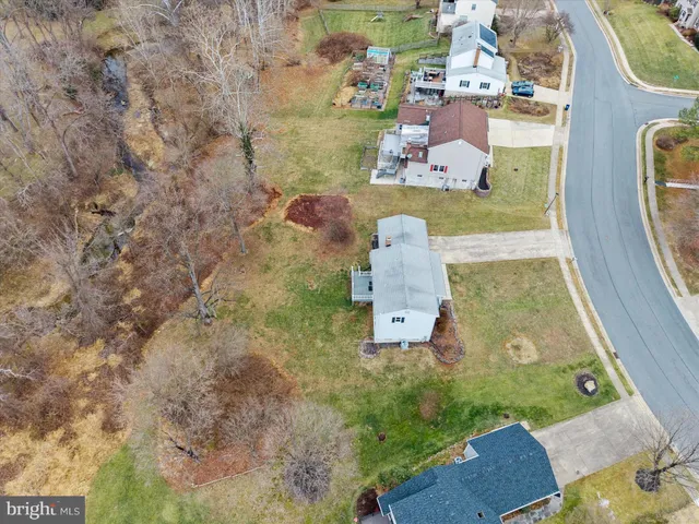 an aerial view of a house with outdoor space