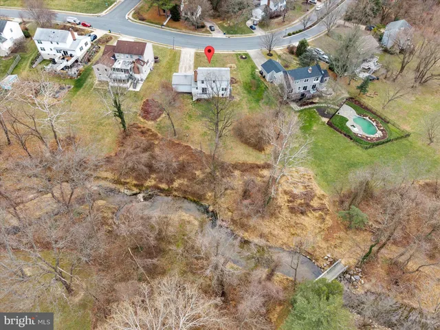 a backyard of a house with lots of green space and tiles