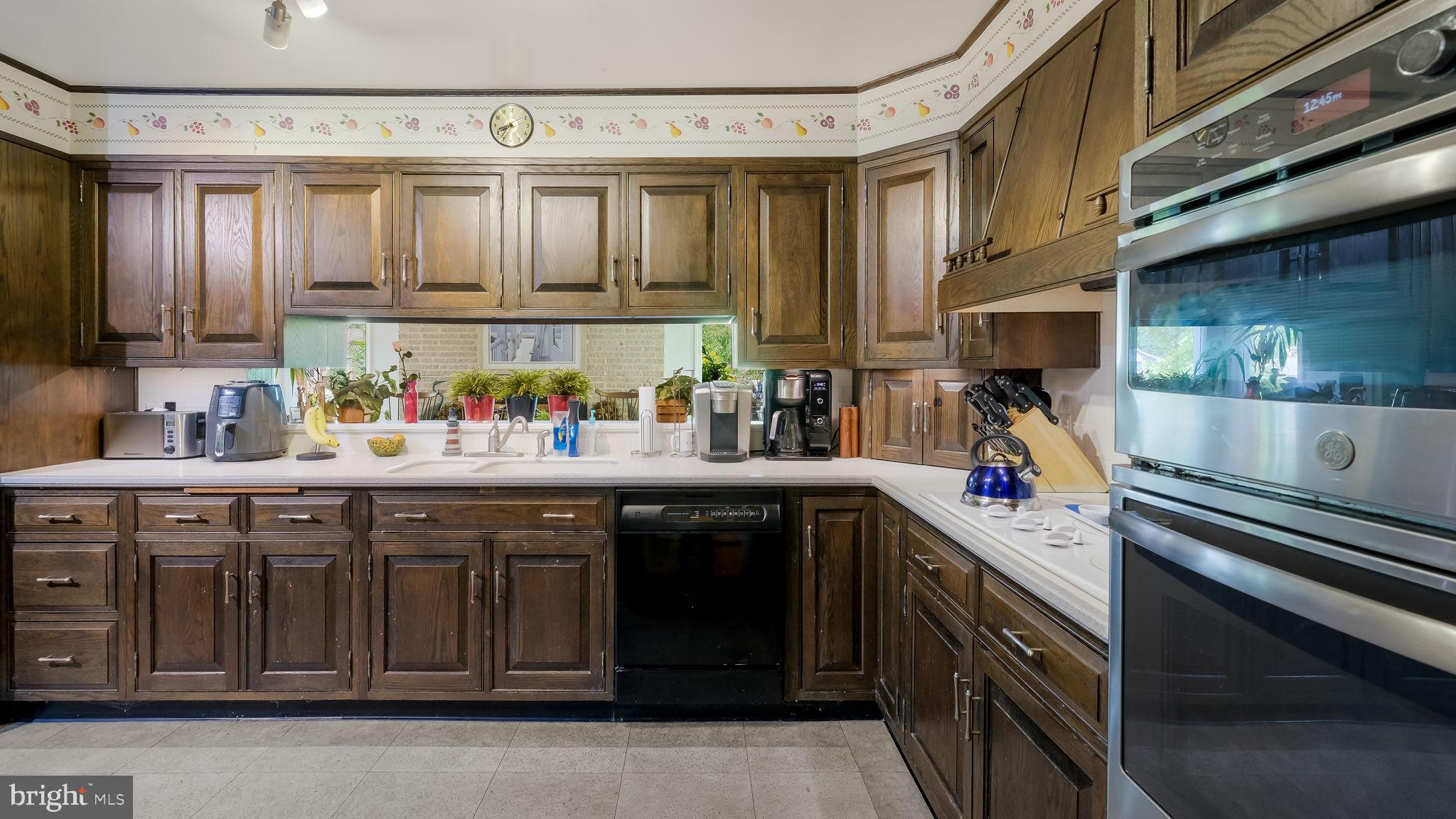 1591 Middletown Road Glen Mills, PA 19342 - Photo 13 of 55 a kitchen with stainless steel appliances granite countertop a sink stove and cabinets